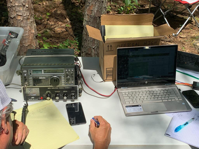 All portable setup using an Icom IC-735 HF radio, MFJ-949E tuner, laptop on a hotspot, and 12V battery (not shown).