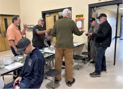 At the Gimme-Your-Money table